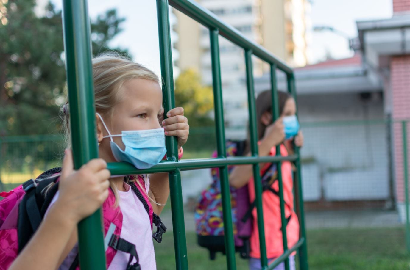 Children at school gates with mask on