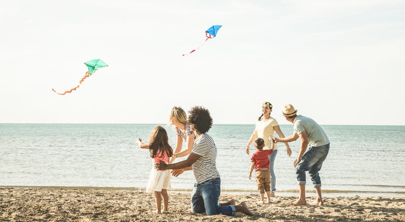 families with kite on the beach