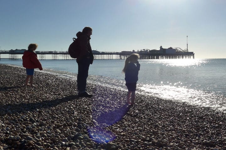 Father and two children at the seaside 