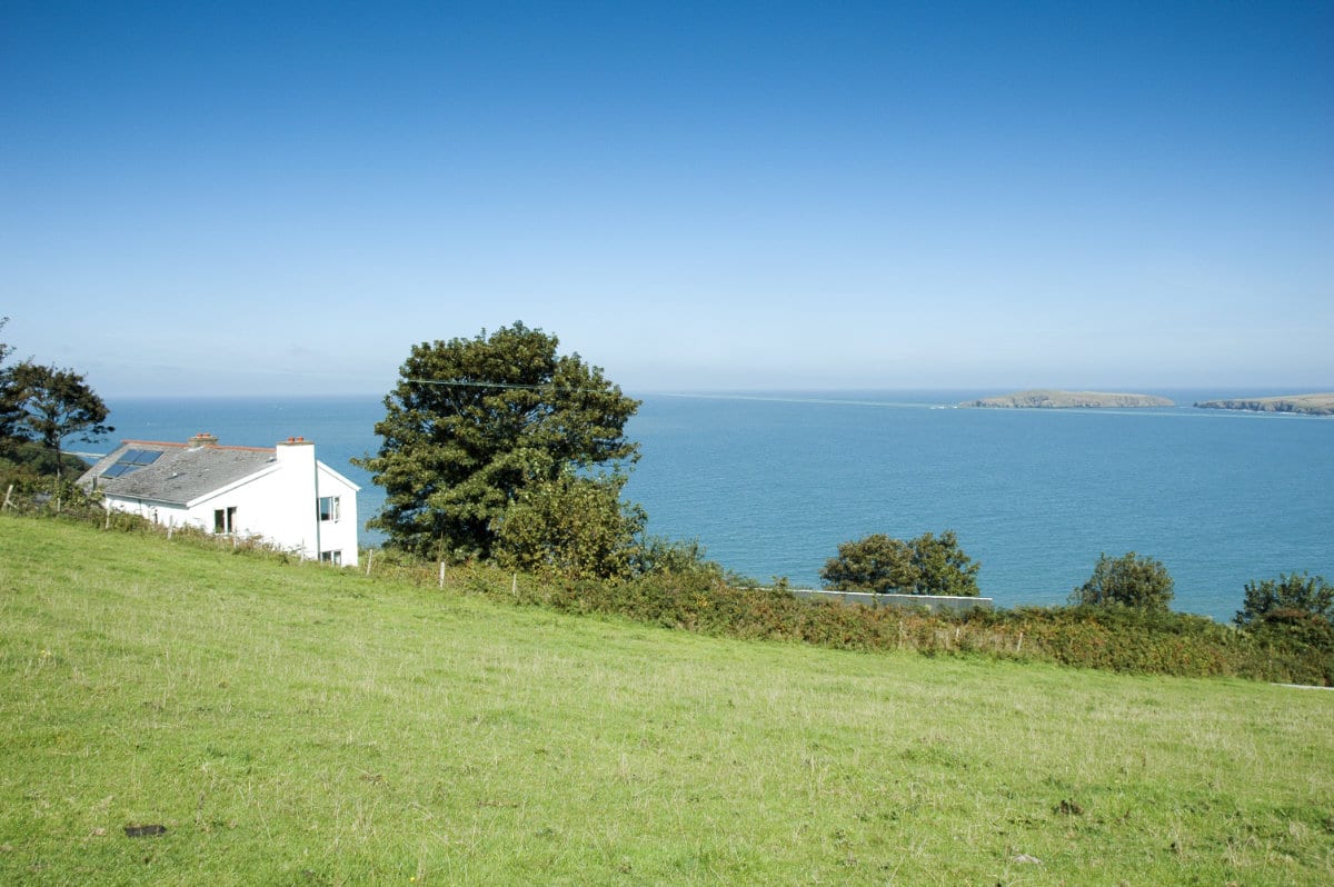 View of YHA Poppit Sands over the sea