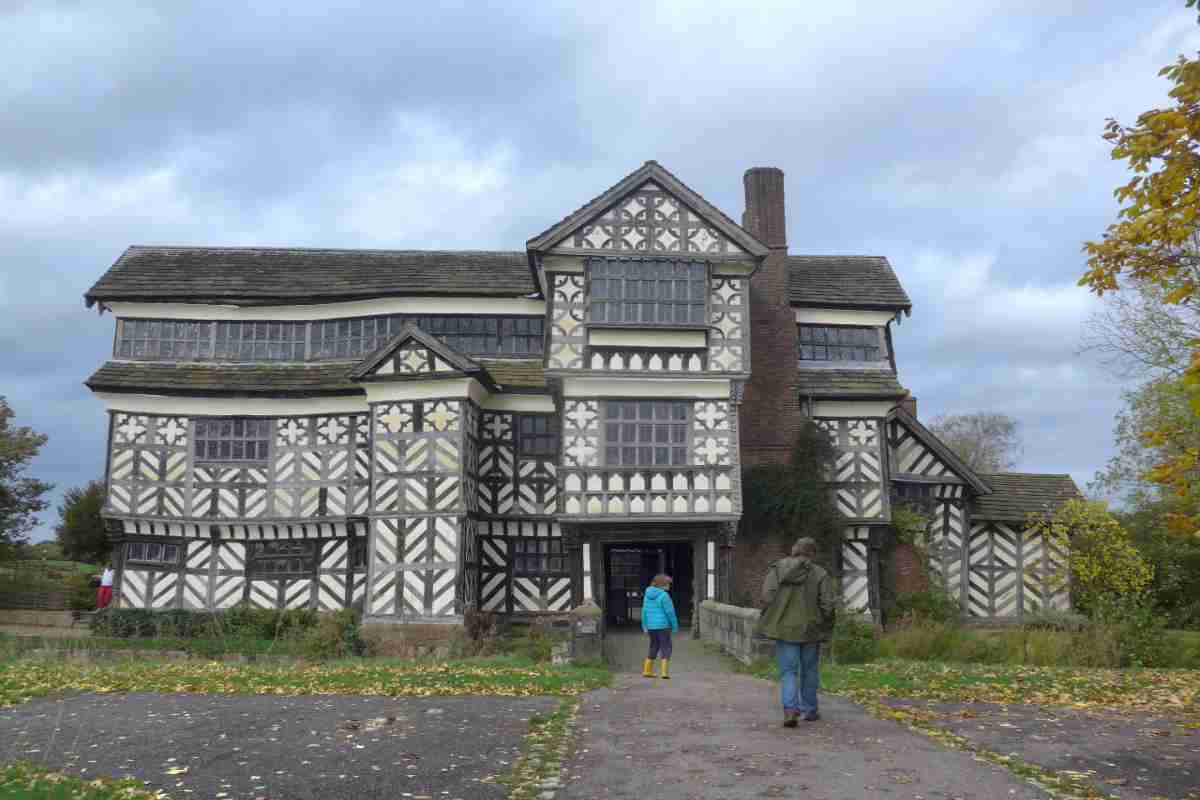 Father and son stood outside a tudor house in Chester