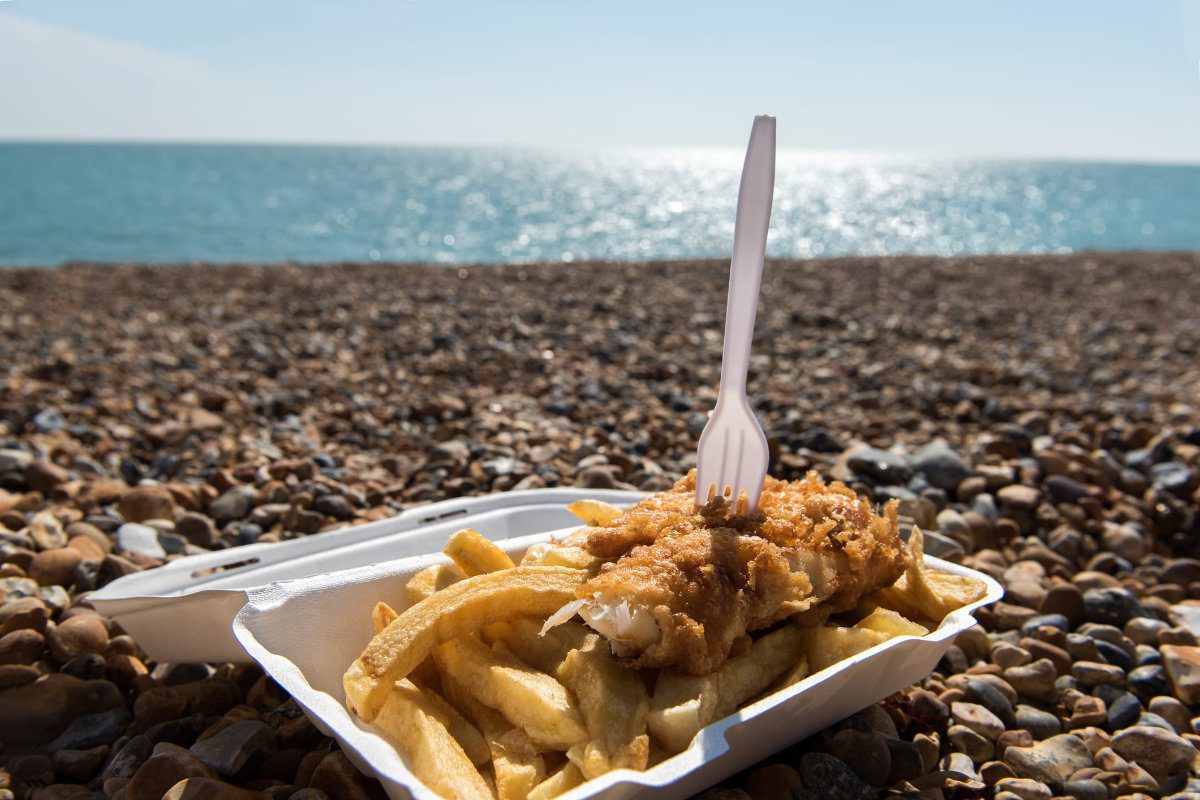 Tray of fish and chips on the beach