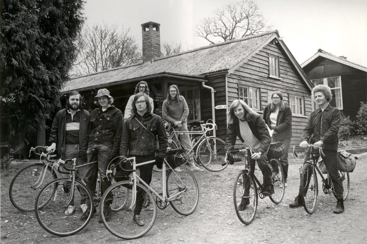 Group with bikes outside a hostel