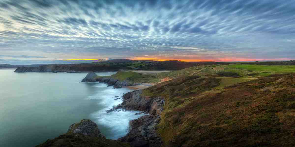 Quilted clouds and a blue hour sunset at Three Cliffs Bay on the Gower Peninsula