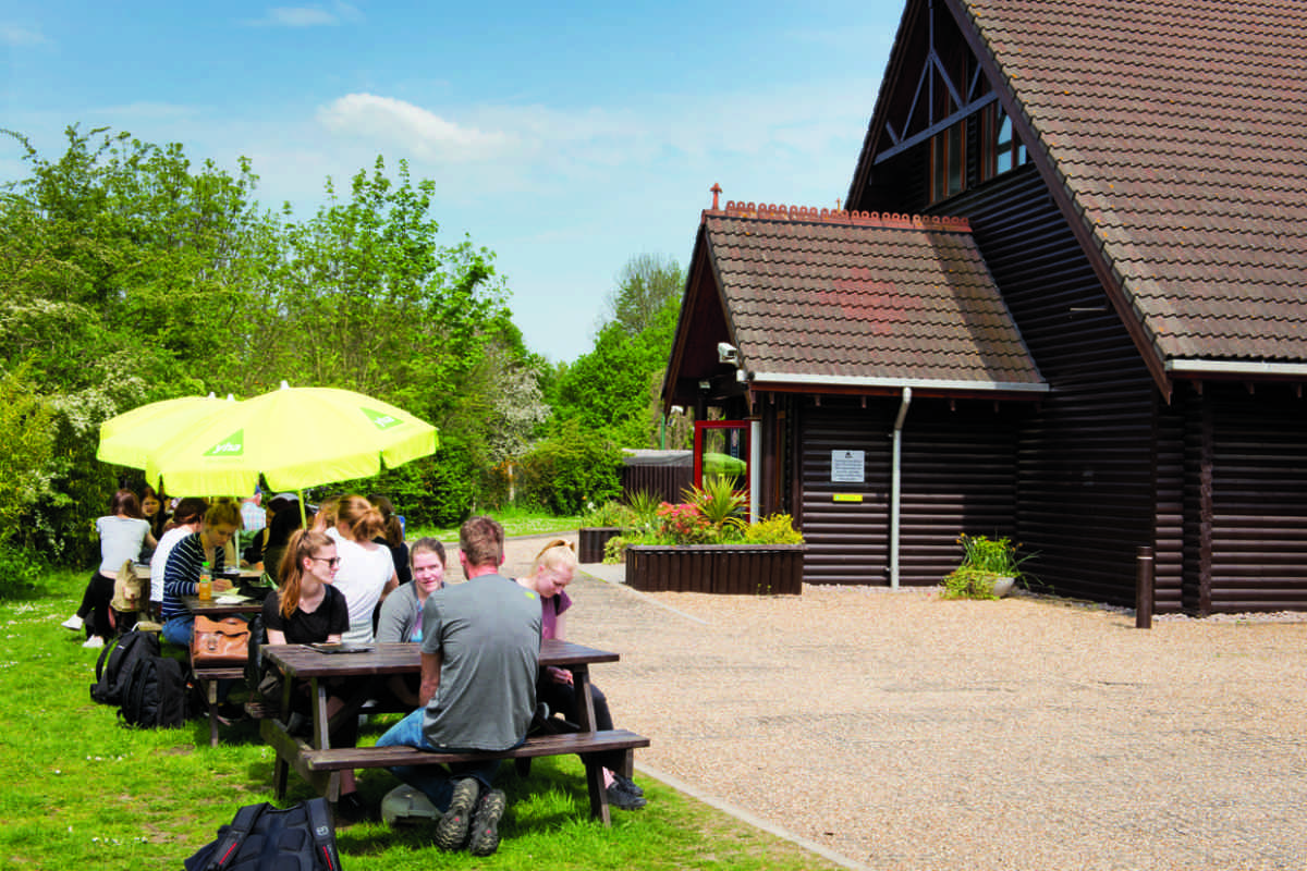 Guests sitting outside YHA London Lee Valley