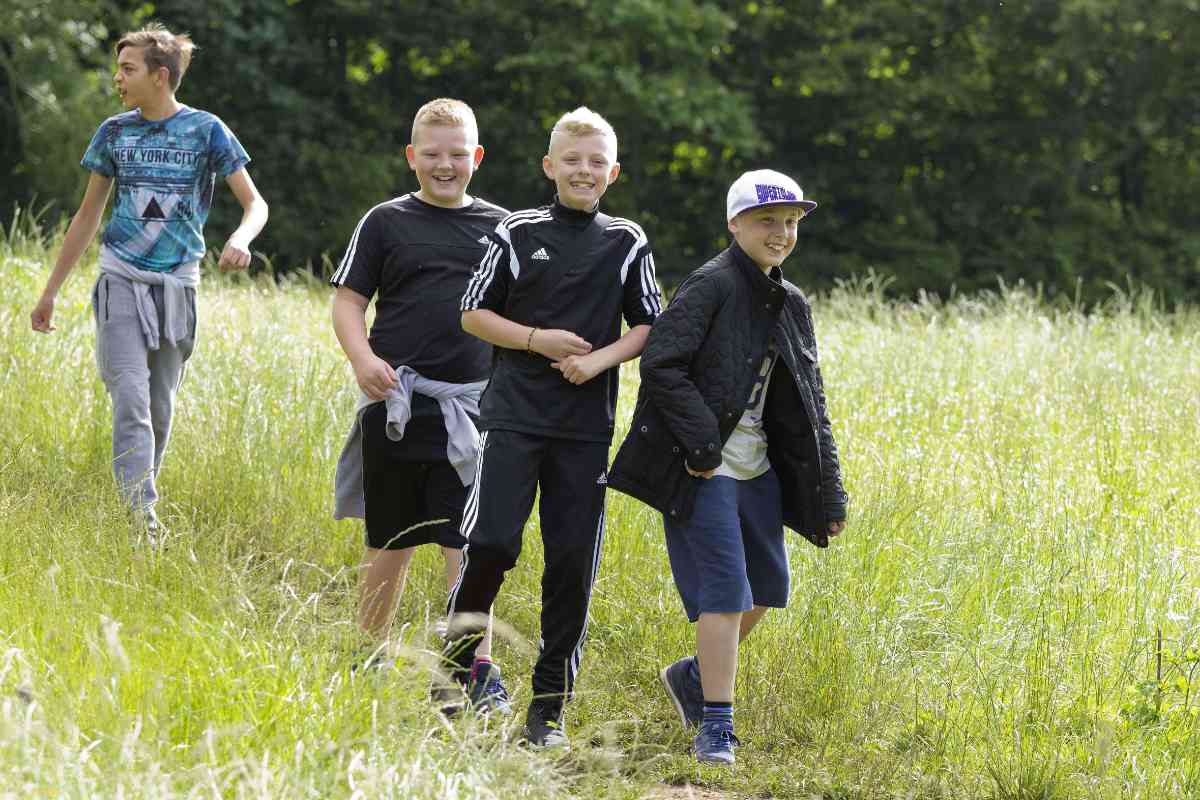 Group of boys walking in the countryside 