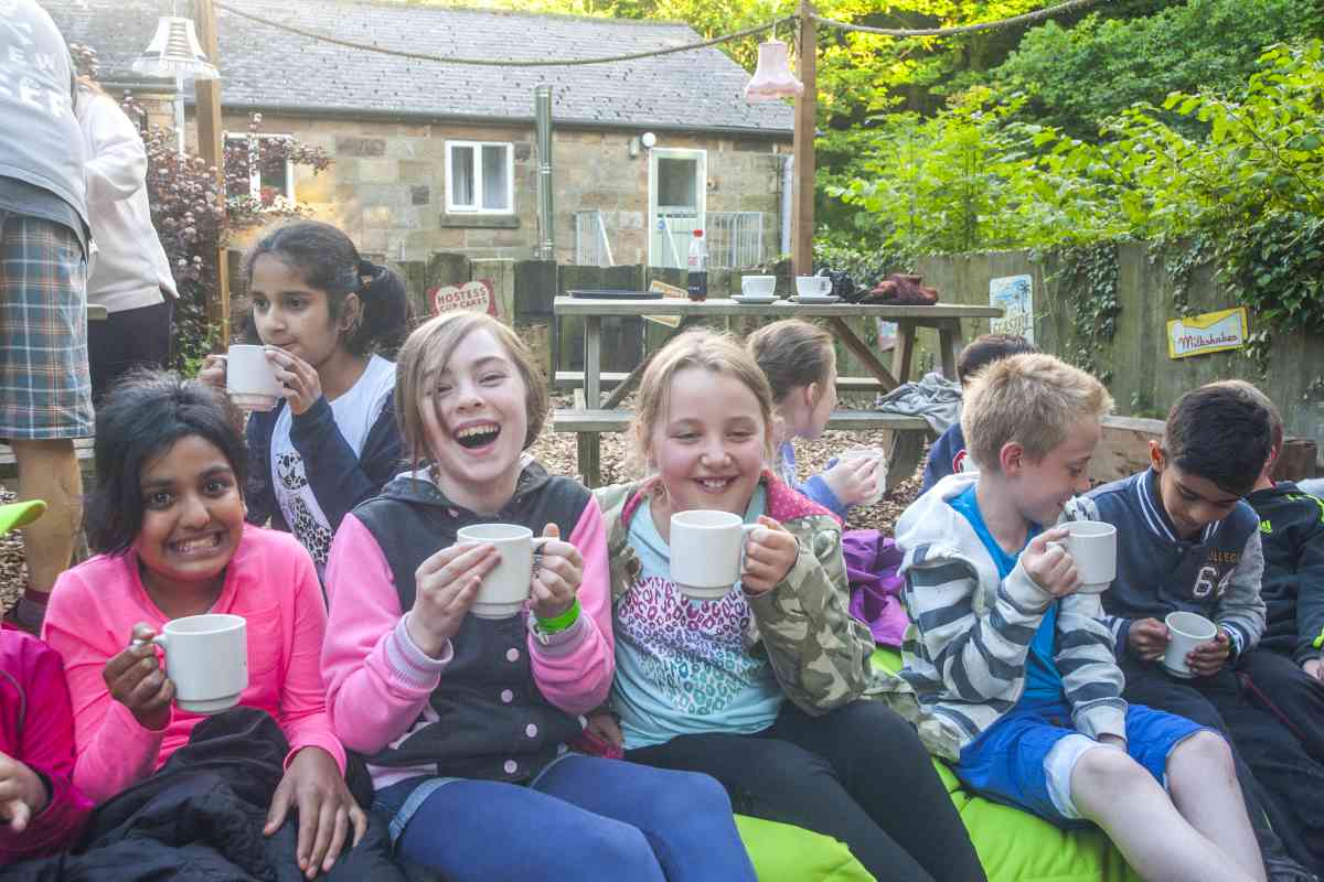 A group of children enjoying a cuppa 