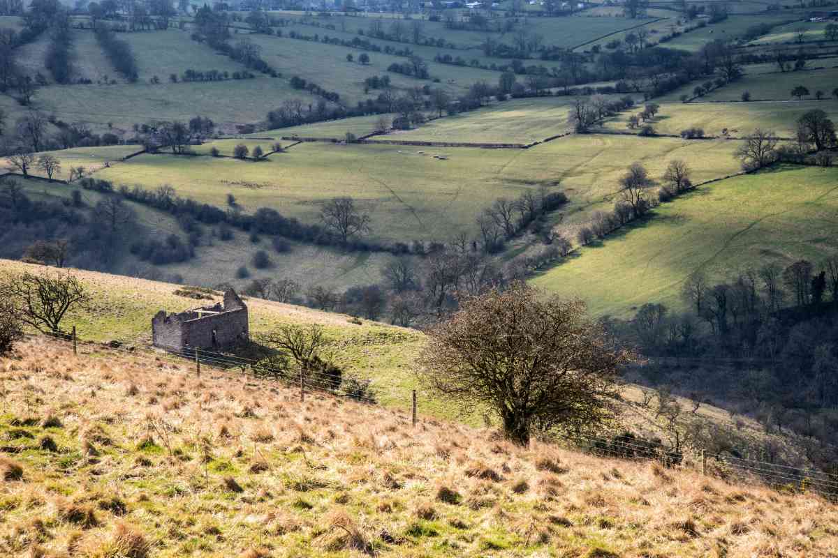 Beautiful landscape image of Peak District on bright sunny spring day