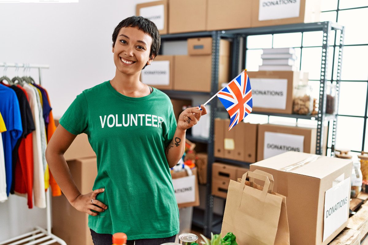 Volunteer with a UK flag