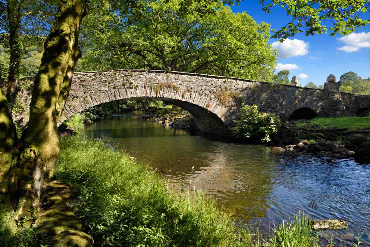 Pelter Bridge in evening sun over the River Rothay in Ambleside
