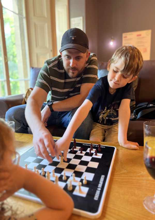 A family playing Chess