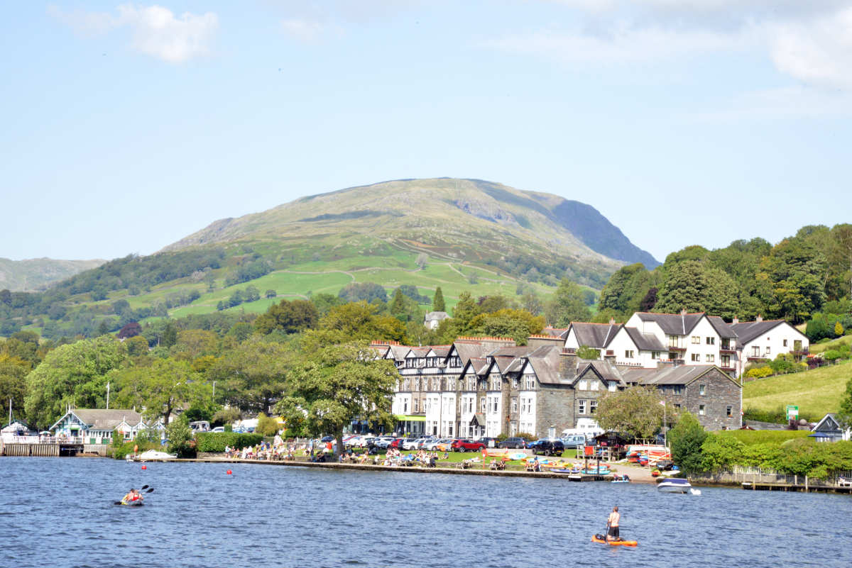 YHA Ambleside on the shores of Windermere with fells in the background