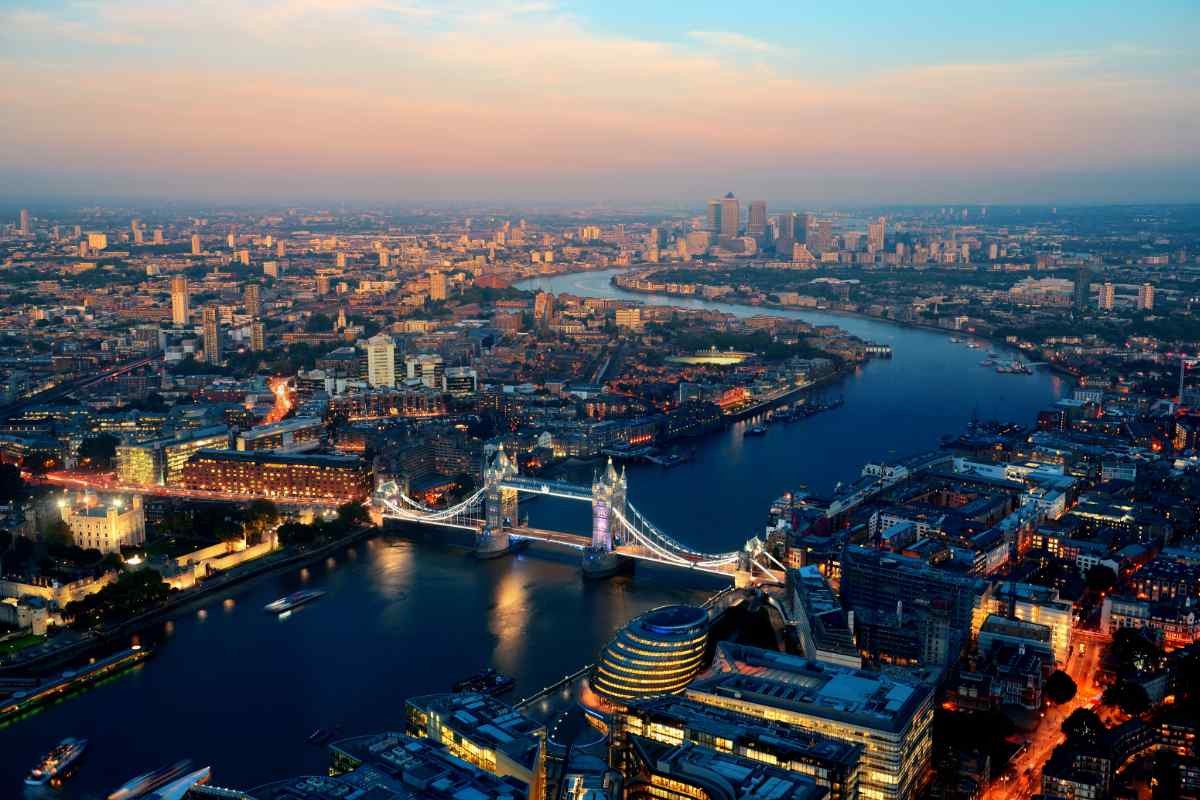 London aerial view panorama blended with sunset and night with urban architectures