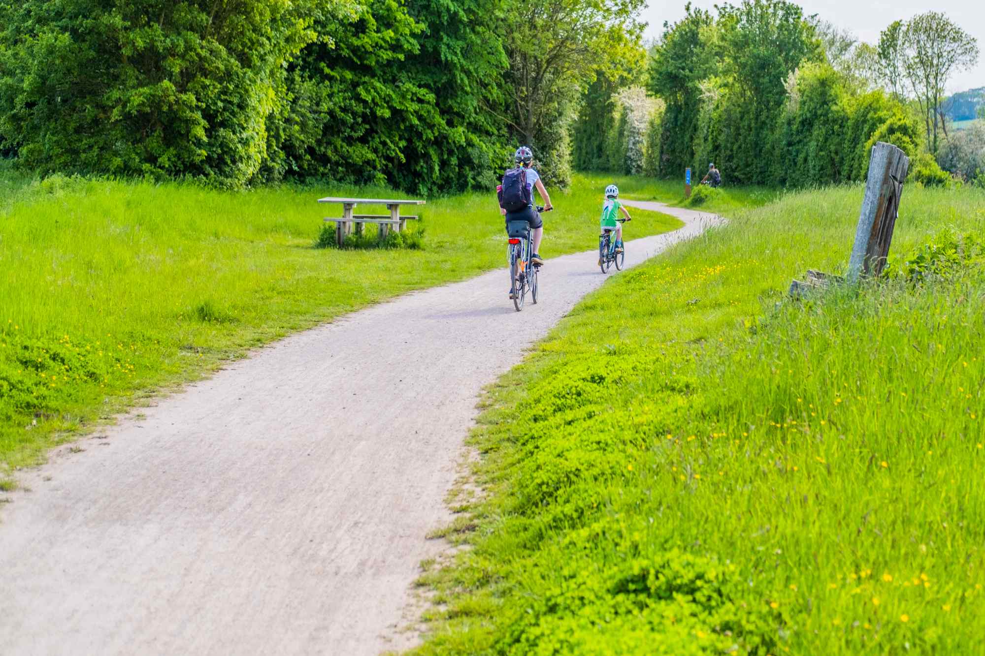 Mother and son cycling along a path in Stratford-upon-Avon