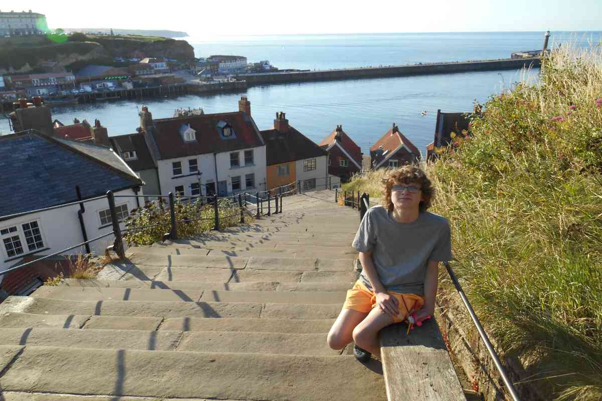 Boy at the top of the Whitby steps 