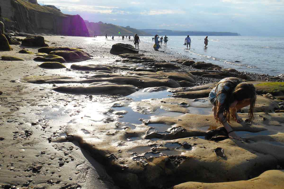 A girl near the rock pools on West Cliff beach